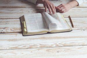 female hands reading bible