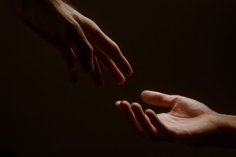 reaching hands