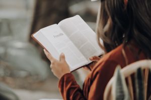 woman reading open bible