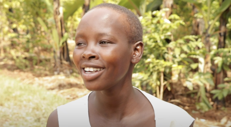 Ugandan woman with greenery