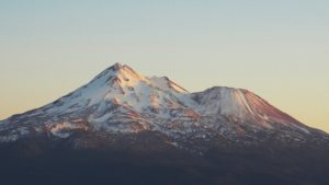 Sun rising over mountains