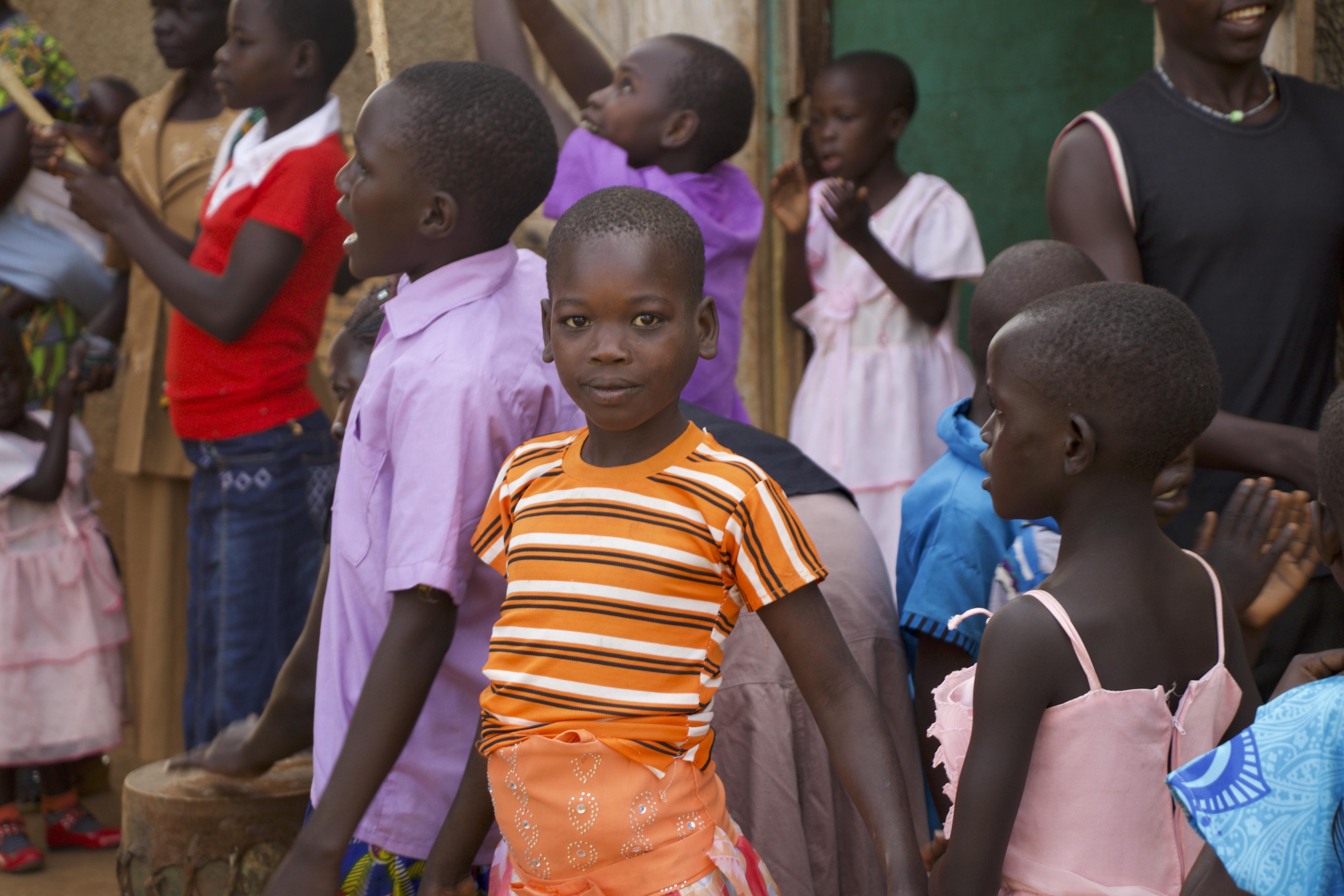 happy ugandan children outside of church