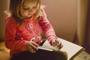 child reading book