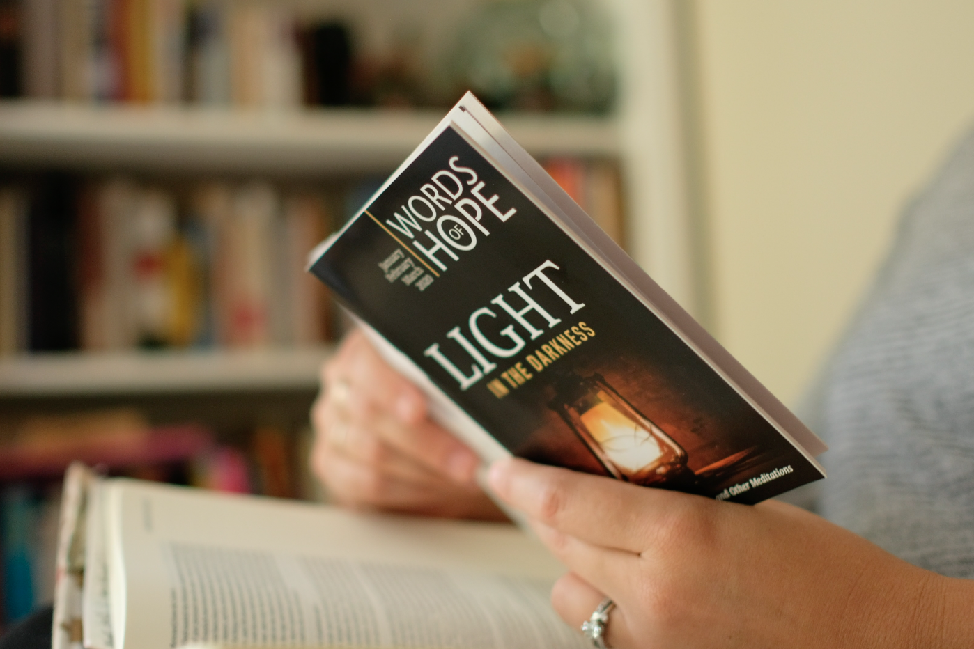 woman doing daily devotions with bible on couch