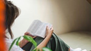 woman sitting reading bible