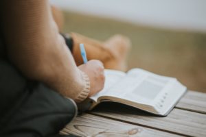 woman sitting reading bible