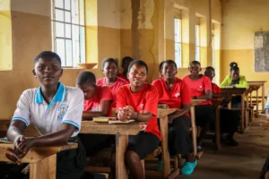 students in uganda sitting at desks